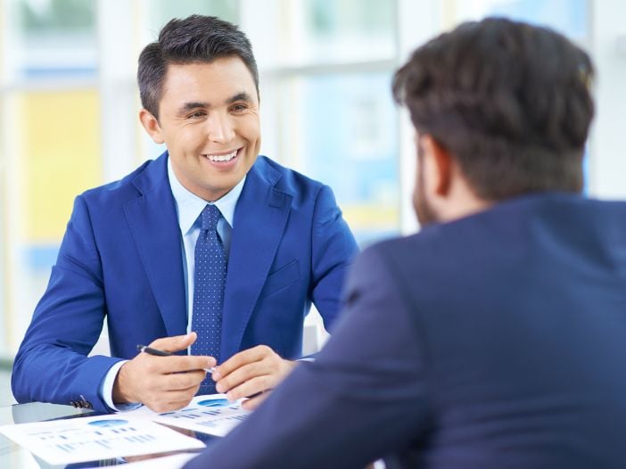 Business owner interviewing a canadate from his listing on a job board