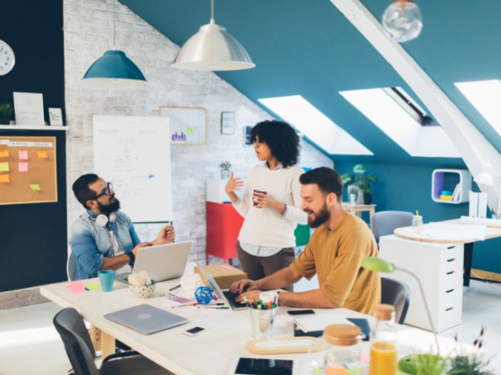 Small startup team having a discussion at conference table