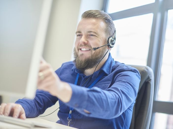 Customer consultant listening to calls for quality control
