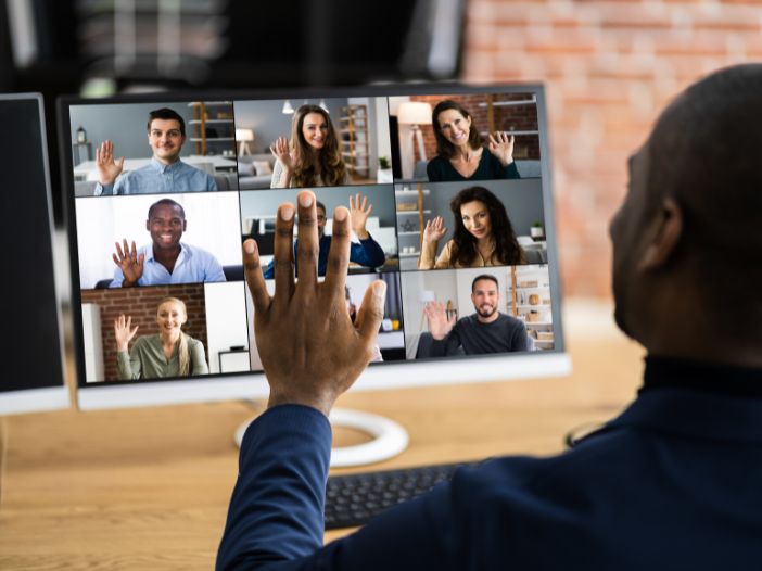 Man waving to his webinar guests