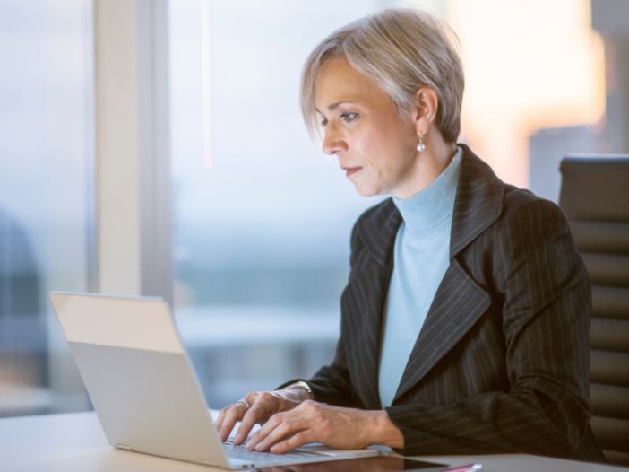 businesswoman sending pitches to journalist